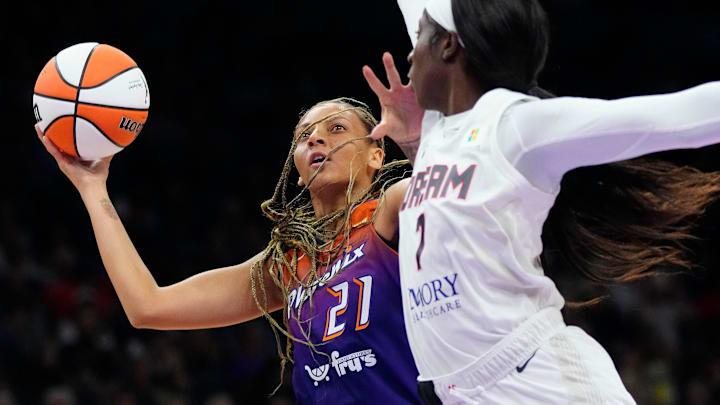 Mercury forward Mikiah Herbert Harrigan (21) shoots against Dream forward Laeticia Amihere (7) during the home opener at the Footprint Center on Saturday, May 18, 2024.