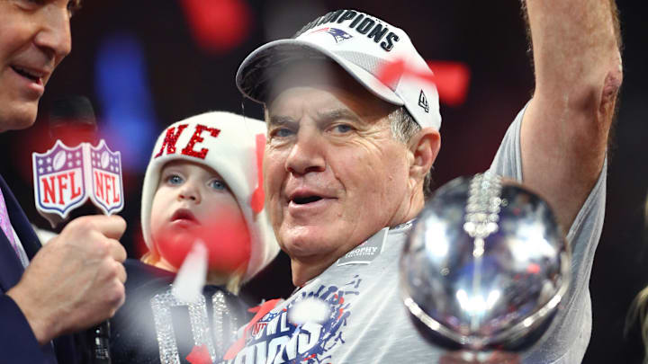 New England Patriots former head coach Bill Belichick celebrates with the Vince Lombardi Trophy after defeating the Los Angeles Rams. New England Patriots former head coach Bill Belichick celebrates with the Vince Lombardi Trophy after defeating the Los Angeles Rams.