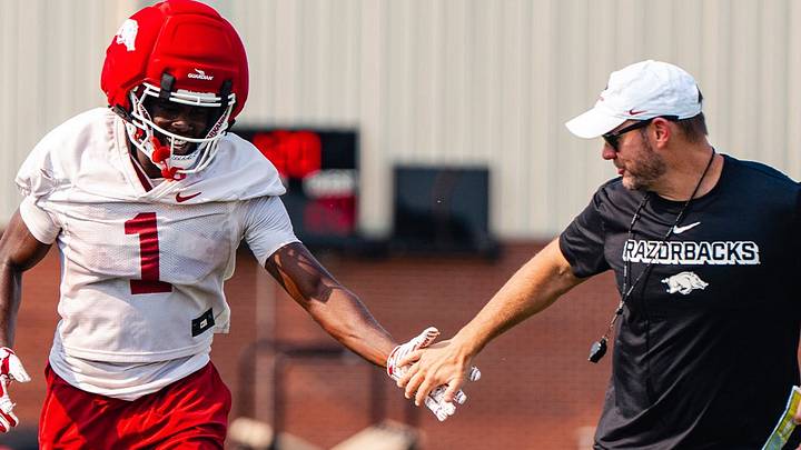 Arkansas coach Ryan Silverfield celebrates following a big play at practice. Arkansas coach Ryan Silverfield celebrates following a big play at practice.