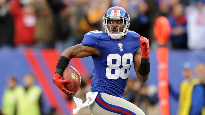 In this 2012 photo, New York Giants wide receiver Hakeem Nicks (88) burns Atlanta Falcons defensive end Kroy Biermann (71) en route to his second score of the day during Sunday's win over the Atlanta Falcons at MetLife Stadium. 