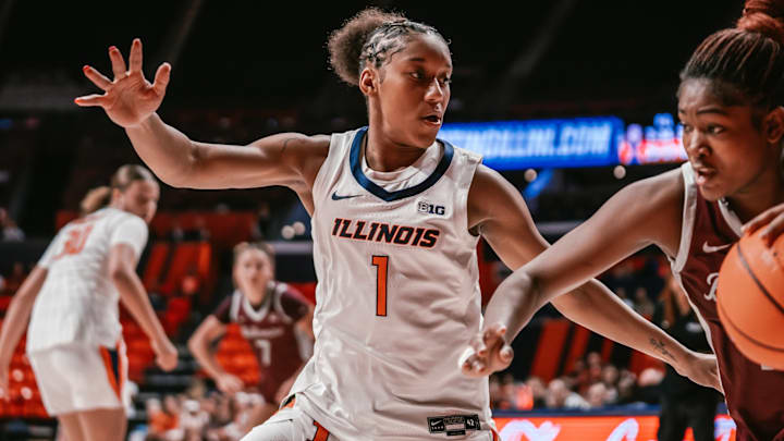 Illinois guard Aaliyah Guyton (1) locks up a Bellarmine ball-handler in the Illini's 90-41 win Tuesday at the State Farm Center in Champaign, Illinois.