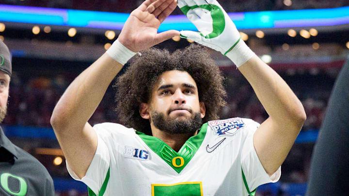Oregon quarterback Dante Moore walks off the field as the Oregon Ducks face the Indiana Hoosiers in the Peach Bowl on Jan. 9, 2026, at Mercedes-Benz Stadium in Atlanta, Georgia.