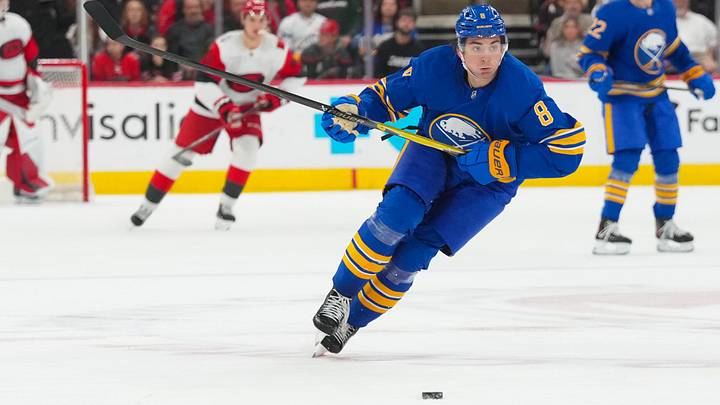 Nov 8, 2025; Raleigh, North Carolina, USA;  Buffalo Sabres defenseman Michael Kesselring (8) skates after the puck against the Carolina Hurricanes during the third period at Lenovo Center. Mandatory Credit: James Guillory-Imagn Images