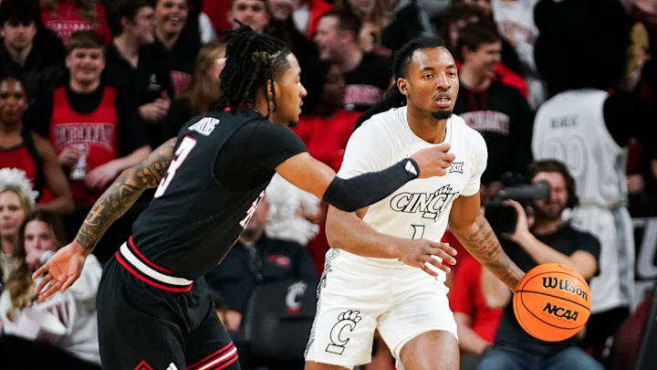 Cincinnati Bearcats guard Day Day Thomas (1) dribbles down the court in the first half of a NCAA men’s basketball game between the Cincinnati Bearcats and Texas Tech Red Raiders, Tuesday, Jan. 21, 2025, at Fifth Third Arena in Cincinnati