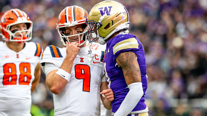 Illinois quarterback Luke Altmyer seems humored by Tacario Davis talking to him. Illinois quarterback Luke Altmyer seems humored by Tacario Davis talking to him.