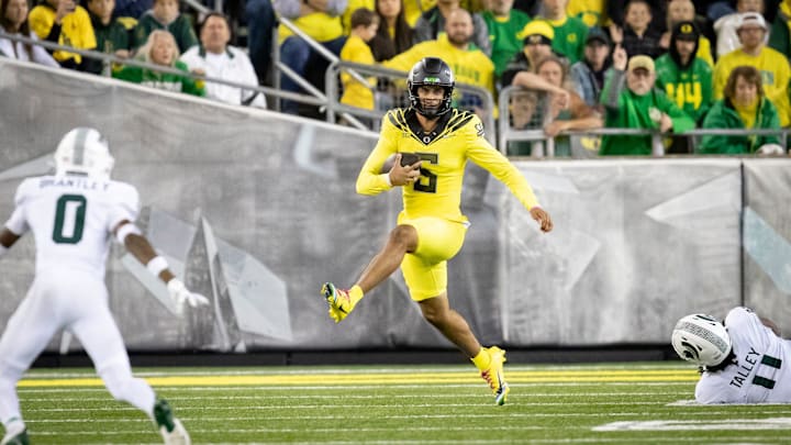 Oregon Ducks quarterback Dante Moore runs the ball as the Ducks host the Spartans on Friday, Oct. 4, 2024, at Autzen Stadium in Eugene, Ore.