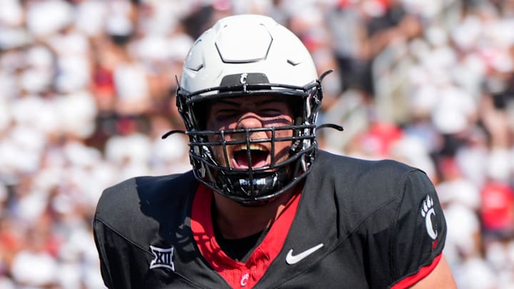 Cincinnati Bearcats offensive lineman Luke Kandra (67) celebrates after Cincinnati Bearcats tight end Payten Singletary (88) scores a touchdown during the first half of the NCAA football game between the Cincinnati Bearcats and the Eastern Kentucky Colonels at Nippert Stadium in Cincinnati on Saturday, Sept. 2, 2023.
