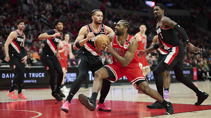 Jan 19, 2025; Portland, Oregon, USA; Chicago Bulls forward Patrick Williams (44) drives to the basket during the first half against Portland Trail Blazers forward Toumani Camara (33) and center Deandre Ayton (2) at Moda Center. Mandatory Credit: Troy Wayrynen-Imagn Images