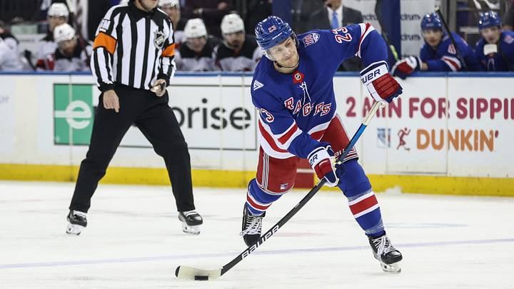 Mar 31, 2026; New York, New York, USA;  New York Rangers defenseman Adam Fox (23) attempts a shot on goal in the second period against the New Jersey Devils at Madison Square Garden. Mandatory Credit: Wendell Cruz-Imagn Images