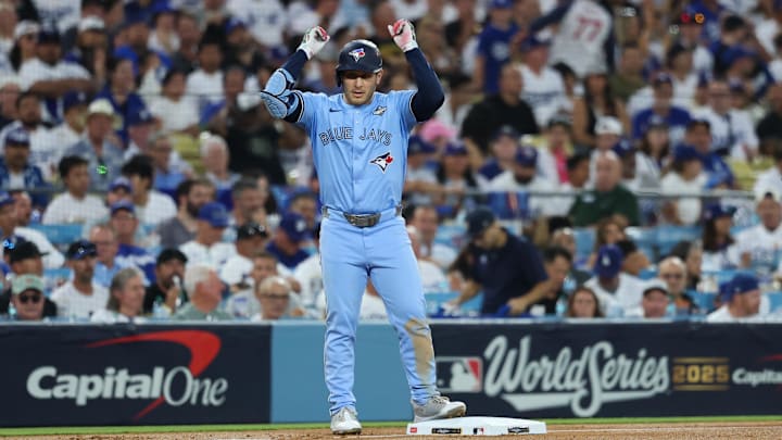 Oct 29, 2025; Los Angeles, California, USA; Toronto Blue Jays center fielder Daulton Varsho (5) celebrates after hitting a triple during the fourth inning against the Los Angeles Dodgers during game five of the 2025 MLB World Series at Dodger Stadium.