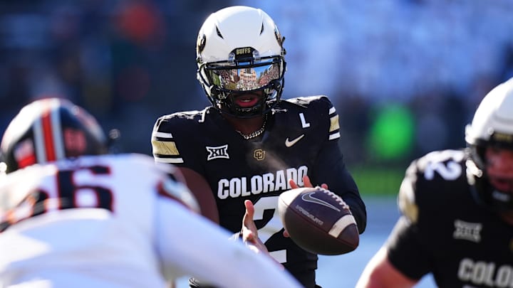 Nov 29, 2024; Boulder, Colorado, USA; Colorado Buffaloes quarterback Shedeur Sanders (2) takes a hike in the first quarter against the Oklahoma State Cowboys at Folsom Field.  