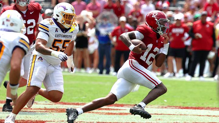 Sep 5, 2026; Tuscaloosa, Alabama, USA; Alabama Crimson Tide quarterback Keelon Russell (12) is pursued by East Carolina Pirates defensive lineman Dominick Moody (55) during the second half at Saban Field at Bryant-Denny Stadium. Mandatory Credit: David Leong-Imagn Images Sep 5, 2026; Tuscaloosa, Alabama, USA; Alabama Crimson Tide quarterback Keelon Russell (12) is pursued by East Carolina Pirates defensive lineman Dominick Moody (55) during the second half at Saban Field at Bryant-Denny Stadium. Mandatory Credit: David Leong-Imagn Images