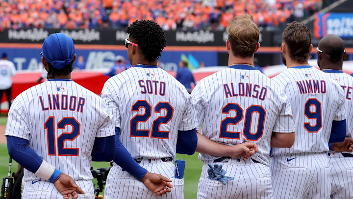 Apr 4, 2025; New York City, New York, USA; New York Mets shortstop Francisco Lindor (12) and right fielder Juan Soto (22) and first baseman Pete Alonso (20) and left fielder Brandon Nimmo (9) stand for the national anthem before the Mets home opener against the Toronto Blue Jays at Citi Field. Mandatory Credit: Brad Penner-Imagn Images