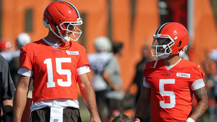 Cleveland Browns quarterback Joe Flacco (15) chats with quarterback Dillon Gabriel (5) during NFL training camp practice at the Cleveland Browns training facility, Wednesday, July 23, 2025, in Berea, Ohio.