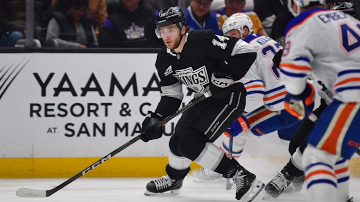 Apr 29, 2025; Los Angeles, California, USA; Los Angeles Kings right wing Alex Laferriere (14) moves the puck against the against the Edmonton Oilers during the second period in game five of the first round of the 2025 Stanley Cup Playoffs at Crypto.com Arena. Mandatory Credit: Gary A. Vasquez-Imagn Images