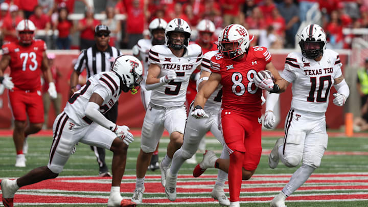 Sep 20, 2025; Salt Lake City, Utah, USA; Utah Utes tight end Dallen Bentley (88) runs after a catch against Texas Tech Red Raiders defensive back Dontae Balfour (20) and linebacker Jacob Rodriguez (10) during the fourth quarter at Rice-Eccles Stadium. Mandatory Credit: Rob Gray-Imagn Images