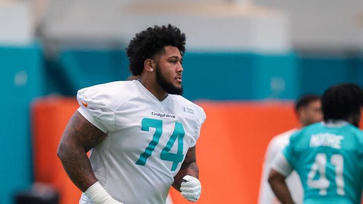Miami Dolphins guard Kadyn Proctor (74) works during rookie minicamp at Baptist Health Training Complex.