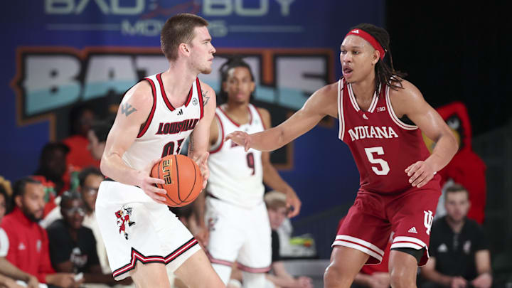 Nov 27, 2024; Paradise Island, Bahamas, BHS; Louisville Cardinals forward Noah Waterman (93) looks to score as Indiana Hoosiers forward Malik Reneau (5) defends during the second half at the Atlantis Resort.  Mandatory Credit: Kevin Jairaj-Imagn Images
