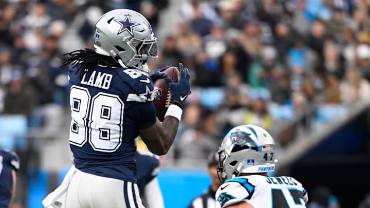 Dallas Cowboys wide receiver CeeDee Lamb with the ball as Carolina Panthers linebacker Josey Jewell defends in the second quarter at Bank of America Stadium. Dallas Cowboys wide receiver CeeDee Lamb with the ball as Carolina Panthers linebacker Josey Jewell defends in the second quarter at Bank of America Stadium.