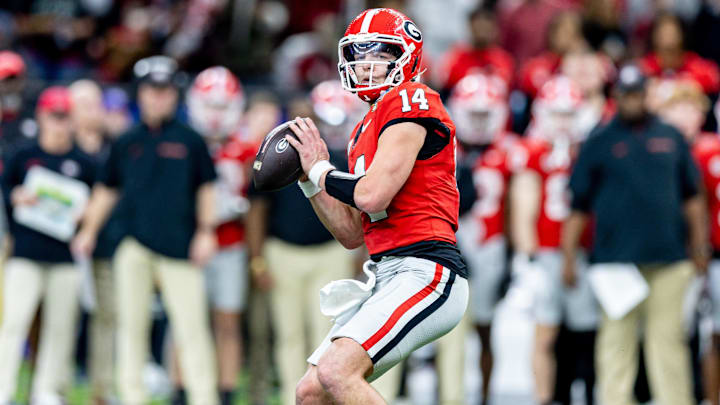Jan 2, 2025; New Orleans, LA, USA;  Georgia Bulldogs quarterback Gunner Stockton (14) drops back to pass against against the Notre Dame Fighting Irish during the second half at Caesars Superdome. Mandatory Credit: Stephen Lew-Imagn Images
