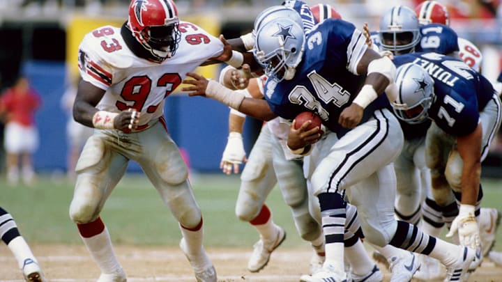 Atlanta Falcons defensive end Aundray Bruce pursues Dallas Cowboys running back Herschel Walker.