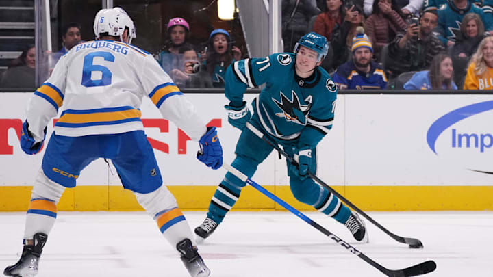 Mar 6, 2026; San Jose, California, USA; San Jose Sharks center Macklin Celebrini (71) scores a goal against while defended by St. Louis Blues defenseman Philip Broberg (6) in the second period at SAP Center at San Jose. Mandatory Credit: David Gonzales-Imagn Images