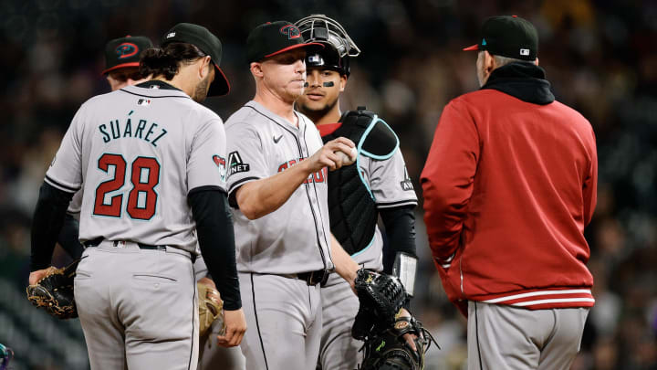 Apr 8, 2024; Denver, Colorado, USA; Arizona Diamondbacks relief pitcher Scott McGough (30) is pulled in the 6th inning. Apr 8, 2024; Denver, Colorado, USA; Arizona Diamondbacks relief pitcher Scott McGough (30) is pulled in the 6th inning.