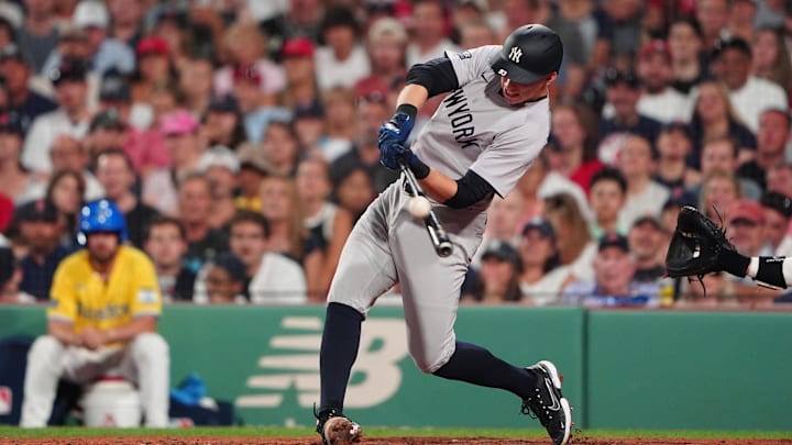 Jul 27, 2024; Boston, Massachusetts, USA; New York Yankees first baseman Ben Rice (93) hits a sacrifice fly ball against the Boston Red Sox during the seventh inning at Fenway Park. Mandatory Credit: Gregory Fisher-Imagn Images