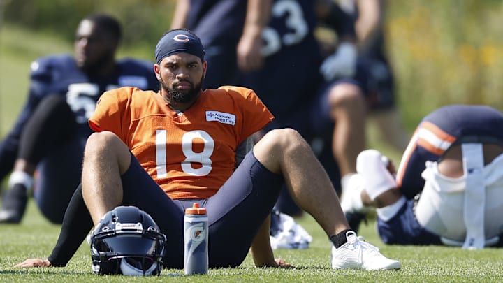 Caleb Williams goes through stretching at Halas Hall, where he has been getting his real work done in preseason.