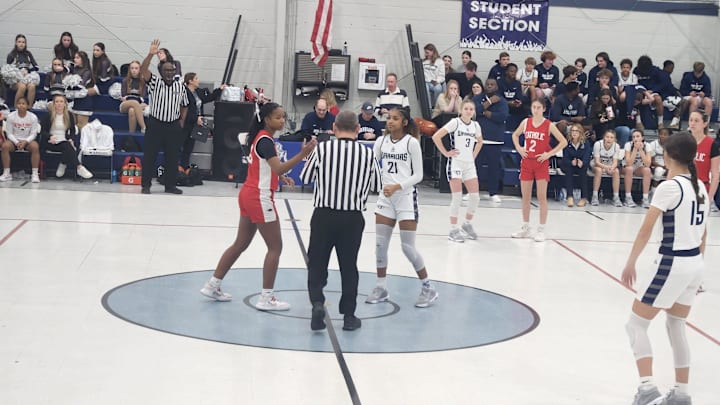 Houma Christian and Catholic-New Iberia meet for the tipoff.