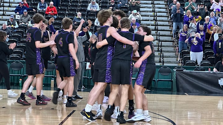 Columbia River players celebrate their Wednesday morning victory against Lakewood in the Class 2A state tournament in the Yakima Valley SunDome.