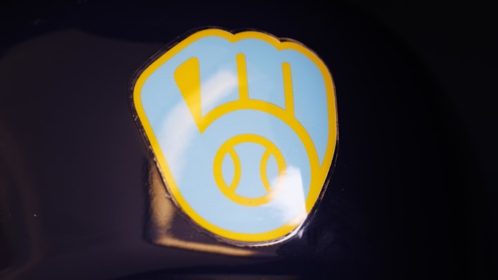 Jun 18, 2023; Milwaukee, Wisconsin, USA;  A Milwaukee Brewers logo on a batting helmet in the dugout prior to the game against the Pittsburgh Pirates at American Family Field. Mandatory Credit: Jeff Hanisch-Imagn Images