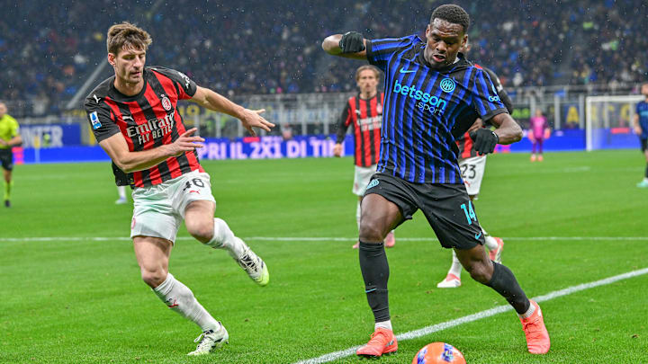 Matteo Gabbia of Milan (L) and Ange-Yoan Bonny of Inter (R)...