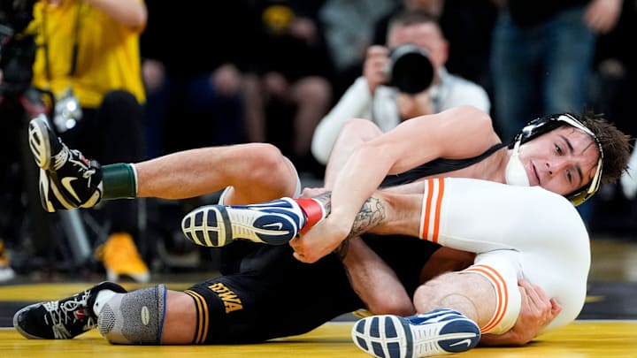 Iowa’s Drake Ayala wrestles Illinois’ Lucas Byrd in a 133-pound match on Friday, Jan. 17, 2025, at Carver-Hawkeye Arena in Iowa City, Iowa. Iowa’s Drake Ayala wrestles Illinois’ Lucas Byrd in a 133-pound match on Friday, Jan. 17, 2025, at Carver-Hawkeye Arena in Iowa City, Iowa.