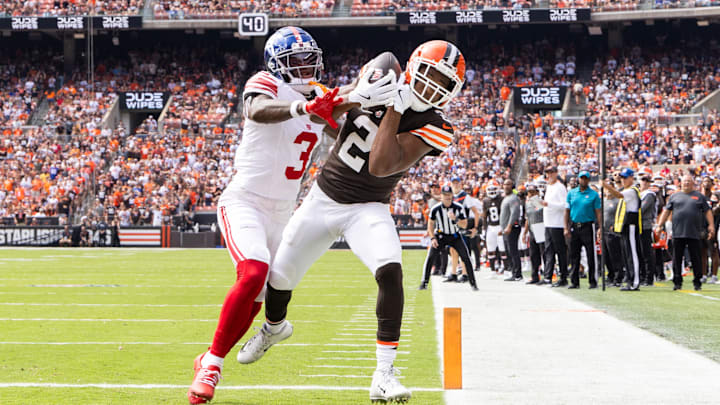 Sep 22, 2024; Cleveland, Ohio, USA; Cleveland Browns wide receiver Amari Cooper (2) makes a touchdown reception under coverage by New York Giants cornerback Deonte Banks (3) during the first quarter at Huntington Bank Field. Mandatory Credit: Scott Galvin-Imagn Images