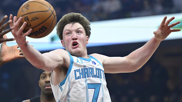 Dec 14, 2025; Cleveland, Ohio, USA; Charlotte Hornets guard Kon Knueppel (7) rebounds in the first quarter against the Cleveland Cavaliers at Rocket Arena. Mandatory Credit: David Richard-Imagn Images
