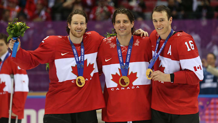 Feb 23, 2014; Sochi, RUSSIA; Canada defenseman Duncan Keith (2), Canada forward Patrick Sharp (10), and Canada forward Jonathan Toews (16) celebrate winning the gold medal against Sweden in the men's ice hockey gold medal game during the Sochi 2014 Olympic Winter Games at Bolshoy Ice Dome. Mandatory Credit: Winslow Townson-Imagn Images