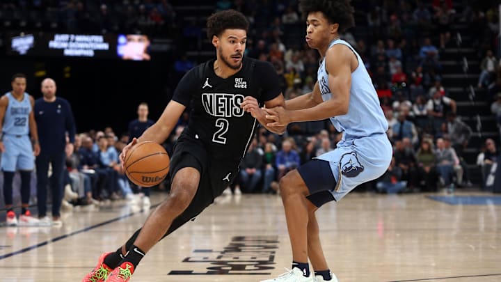 Dec 13, 2024; Memphis, Tennessee, USA; Brooklyn Nets forward Cameron Johnson (2) drives to the basket as Memphis Grizzlies forward Jaylen Wells (0) defends during the second quarter at FedExForum. Mandatory Credit: Petre Thomas-Imagn Images