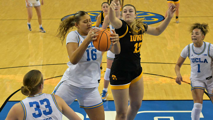 Feb 1, 2026; Los Angeles, California, USA;  UCLA Bruins forward Sienna Betts (16) beats Iowa Hawkeyes center Layla Hays (12) to a rebound in the second half at Pauley Pavilion presented by Wescom Financial. Mandatory Credit: Jayne Kamin-Oncea-Imagn Images