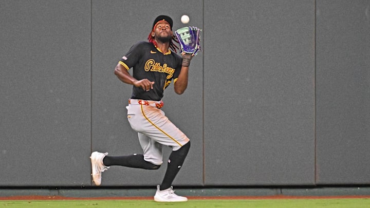 Jul 9, 2025; Kansas City, Missouri, USA;  Pittsburgh Pirates center fielder Oneil Cruz (15) catches a fly ball in the eighth inning against the Kansas City Royals at Kauffman Stadium. Mandatory Credit: Peter Aiken-Imagn Images