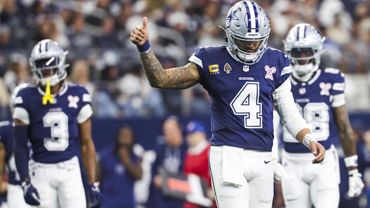 Dallas Cowboys quarterback Dak Prescott signals towards the sideline following a play against the Los Angeles Chargers.