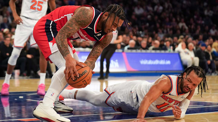Nov 3, 2025; New York, New York, USA; Washington forward Cam Whitmore (1) battles New York Knicks guard Jalen Brunson (11) for a ball during the second half at Madison Square Garden. Mandatory Credit: Lucas Boland-Imagn Images