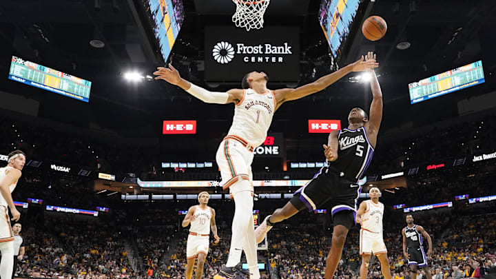 Nov 17, 2023; San Antonio, Texas, USA; Sacramento Kings guard De'Aaron Fox (5) shoots over San Antonio Spurs forward Victor Wembanyama (1) during the second half at Frost Bank Center. Mandatory Credit: Scott Wachter-USA TODAY Sports