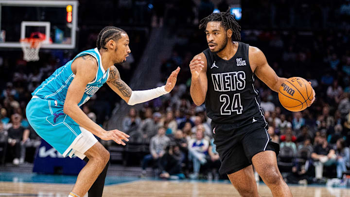 Mar 8, 2025; Charlotte, North Carolina, USA; Brooklyn Nets guard Cam Thomas (24) drives on Charlotte Hornets guard Nick Smith Jr. (8) during the second quarter at Spectrum Center. Mandatory Credit: Scott Kinser-Imagn Images
