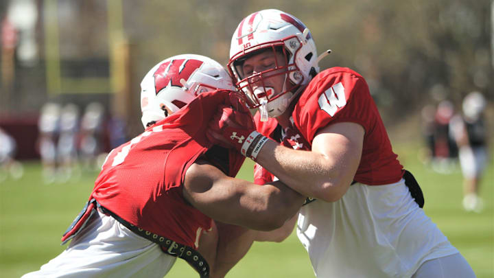 Wisconsin tight end Riley Nowakowski (left) takes on Grant Stec (right) during spring practice outside Camp Randall Stadium in Madison, Wisconsin on Saturday April 13, 2024.