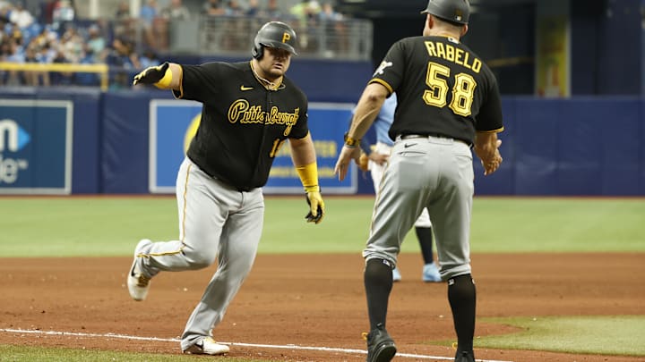 St. Petersburg, Florida, USA; Pittsburgh Pirates first baseman Daniel Vogelbach (19) is congratulated by third base coach Mike Rabelo (58) after he hits a home run against the Tampa Bay Rays during the eighth inning at Tropicana Field. St. Petersburg, Florida, USA; Pittsburgh Pirates first baseman Daniel Vogelbach (19) is congratulated by third base coach Mike Rabelo (58) after he hits a home run against the Tampa Bay Rays during the eighth inning at Tropicana Field.
