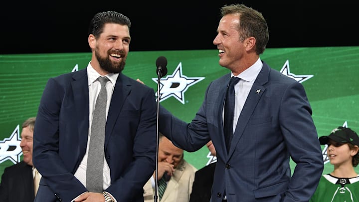 Jun 22, 2018; Dallas, TX, USA; Dallas Stars former player Mike Modano (right) and current player