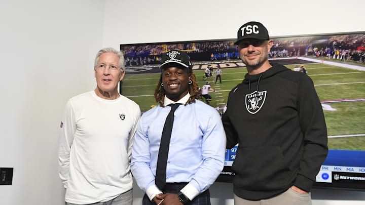 Apr 25, 2025; Henderson, NV, USA; (L-R) Las Vegas Raiders head coach Pete Carroll, Ashton Jeanty and general manager John Spytek pose after a news conference introducing Jeanty as the first round draft pick in the 2025 NFL Draft at Intermountain Health Performance Center. Mandatory Credit: Candice Ward-Imagn Images