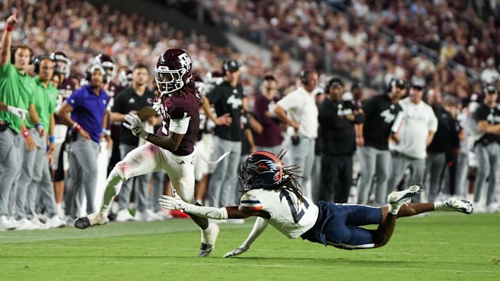 Aug 30, 2025; College Station, Texas, USA; Texas A&M Aggies wide receiver Mario Craver (1) escapes a tackle from UTSA Roadrunners safety Brandon Jacob Jr. (21) in the second half against the UTSA Roadrunners at Kyle Field. Mandatory Credit: Sean Thomas-Imagn Images Aug 30, 2025; College Station, Texas, USA; Texas A&M Aggies wide receiver Mario Craver (1) escapes a tackle from UTSA Roadrunners safety Brandon Jacob Jr. (21) in the second half against the UTSA Roadrunners at Kyle Field. Mandatory Credit: Sean Thomas-Imagn Images