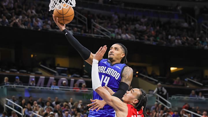 Orlando Magic guard Gary Harris (14) goes to the basket against Portland Trail Blazers guard Dalano Banton (5) during the second half at Amway Center.